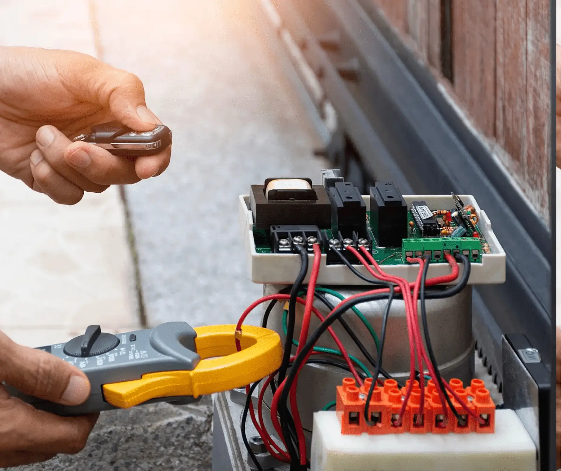 Auto gate repair in progress with tools and equipment